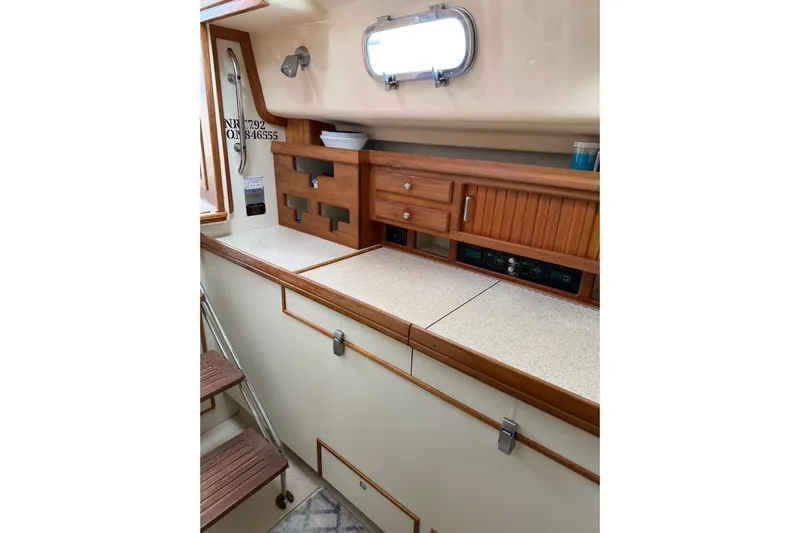  Yacht Photos Pics 2008 Island Packet SP Cruiser interior with wooden cabinetry and countertop.