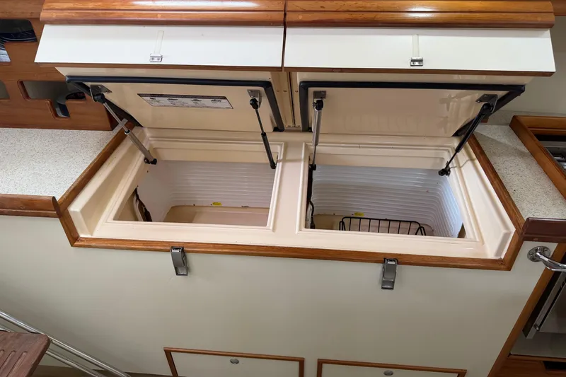  Yacht Photos Pics 2008 Island Packet SP Cruiser galley with open storage compartments.