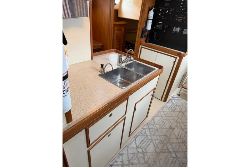  Yacht Photos Pics 2008 Island Packet SP Cruiser galley with sink, countertop, and storage cabinets.