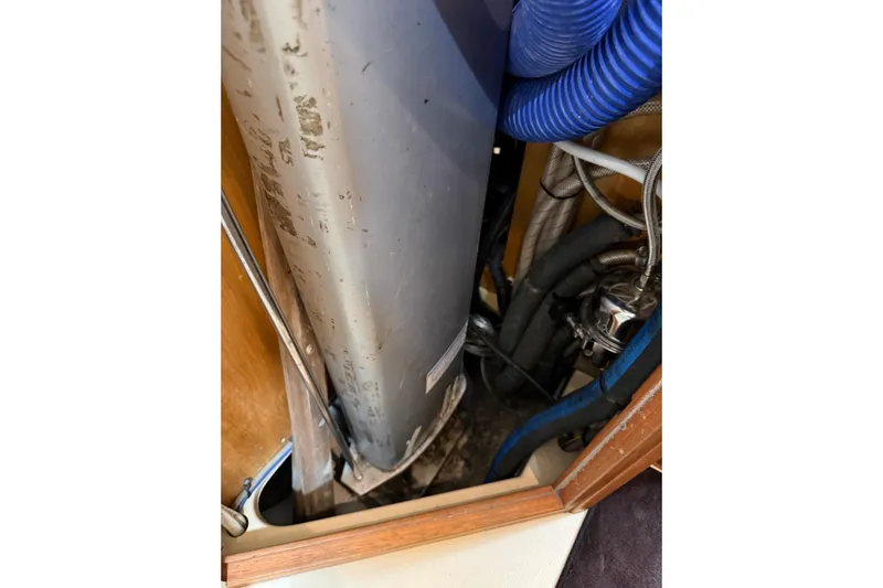  Yacht Photos Pics 2008 Island Packet SP Cruiser engine compartment with hoses and metal components.