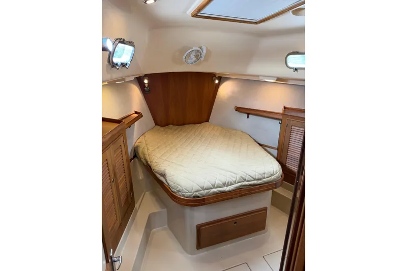  Yacht Photos Pics Cozy cabin interior of 2008 Island Packet SP Cruiser with a comfortable bed.