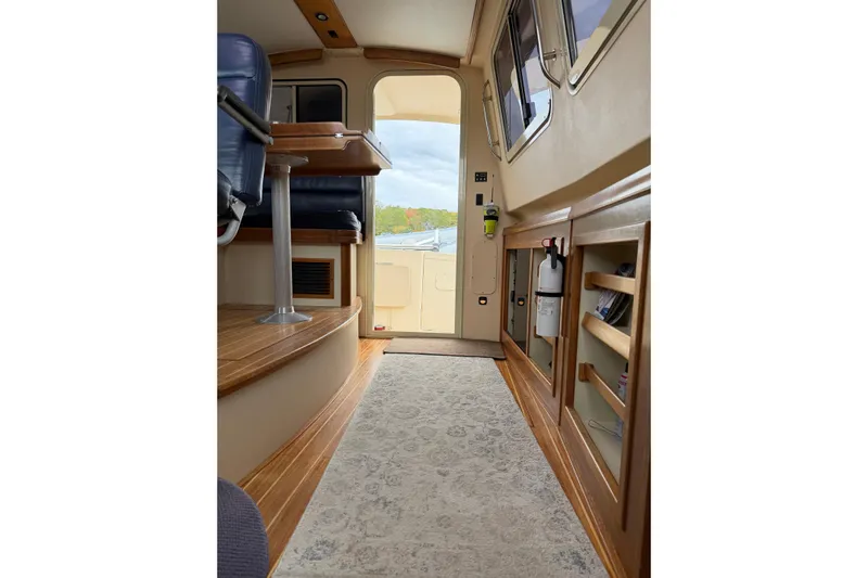  Yacht Photos Pics 2008 Island Packet SP Cruiser interior with wood flooring and seating, showcasing elegant design.