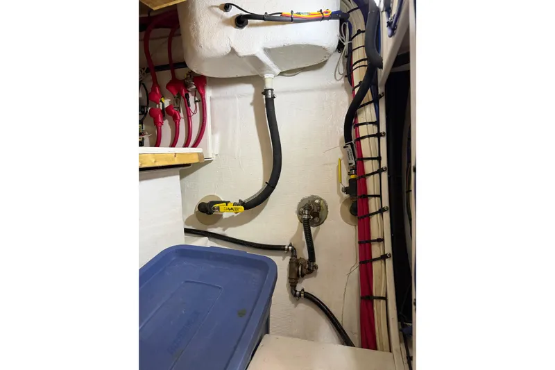  Yacht Photos Pics Engine room of 2008 Island Packet SP Cruiser with hoses and storage container.