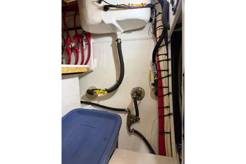  Yacht Photos Pics 2008 Island Packet SP Cruiser engine room with hoses and wiring.