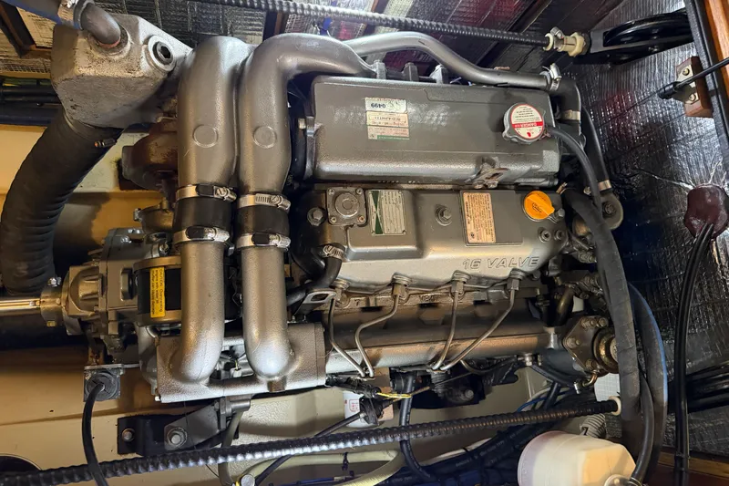  Yacht Photos Pics Engine of a 2008 Island Packet SP Cruiser sailboat, showcasing mechanical components.