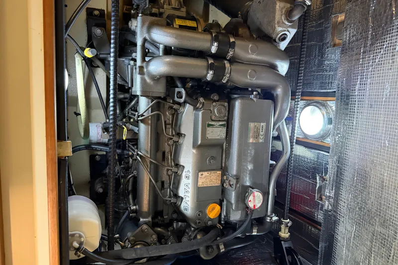  Yacht Photos Pics Engine compartment of a 2008 Island Packet SP Cruiser sailboat, showcasing detailed machinery.