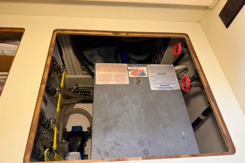  Yacht Photos Pics 2008 Island Packet SP Cruiser engine compartment with valves and labels visible.