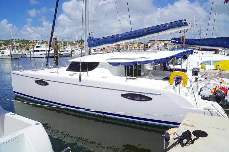 Red Yacht Photos Pics 2008 Fountaine Pajot Orana 44 catamaran docked in a sunny marina.