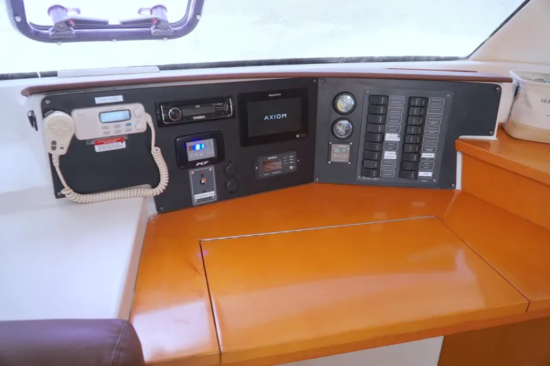 Red Yacht Photos Pics Control panel of 2008 Fountaine Pajot Orana 44 catamaran with navigation and communication equipment.