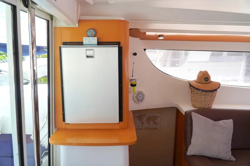 Red Yacht Photos Pics Interior of 2008 Fountaine Pajot Orana 44 catamaran with cozy seating and nautical decor.