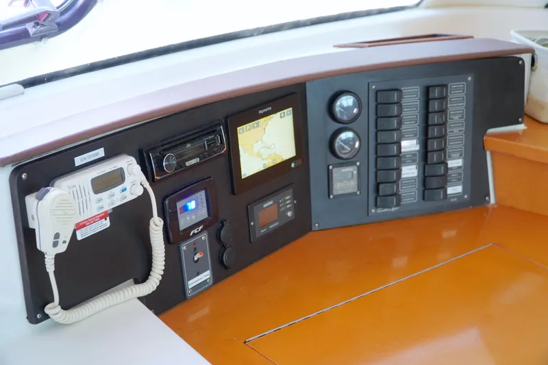 Red Yacht Photos Pics Control panel of 2008 Fountaine Pajot Orana 44 catamaran with navigation and communication equipment.