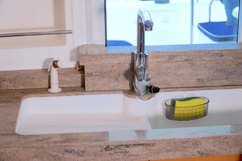 Red Yacht Photos Pics Kitchen sink area on a 2008 Fountaine Pajot Orana 44 catamaran.