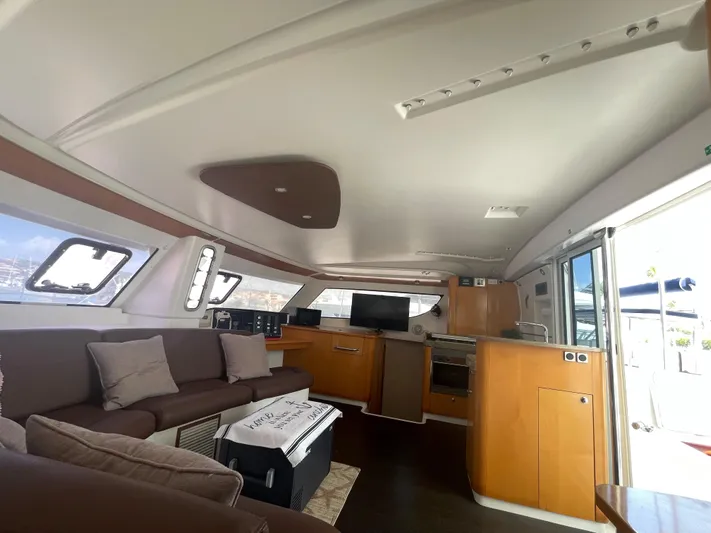Red Yacht Photos Pics Luxurious interior of 2008 Fountaine Pajot Orana 44 catamaran with modern furnishings.