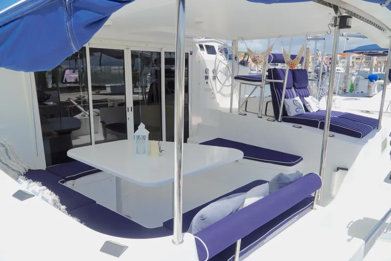 Red Yacht Photos Pics 2008 Fountaine Pajot Orana 44 catamaran with spacious outdoor seating and dining area.