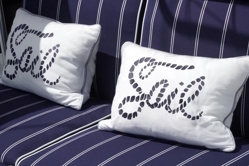 Red Yacht Photos Pics Nautical-themed cushions on a Fountaine Pajot Orana 44, 2008 model, with "Sail" text.