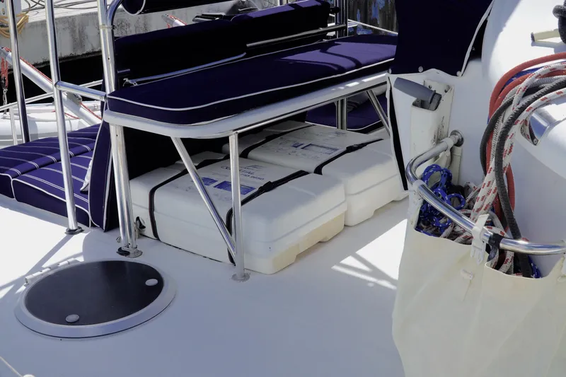 Red Yacht Photos Pics Deck of 2008 Fountaine Pajot Orana 44 catamaran with storage and seating.