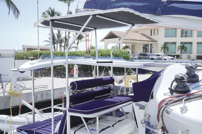 Red Yacht Photos Pics 2008 Fountaine Pajot Orana 44 catamaran docked, featuring a shaded seating area.