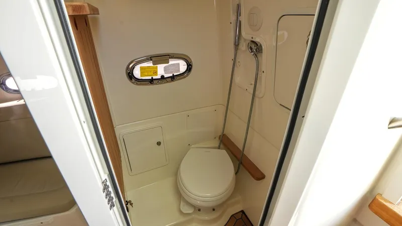  Yacht Photos Pics 2019 Boston Whaler 380 Outrage boat bathroom interior with toilet and shower.