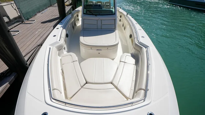  Yacht Photos Pics 2019 Boston Whaler 380 Outrage boat with spacious seating in a marina.