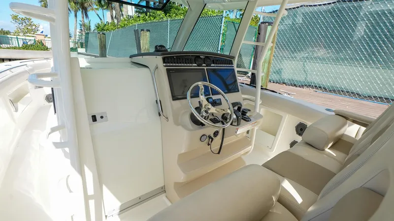  Yacht Photos Pics 2019 Boston Whaler 380 Outrage helm with modern controls and comfortable seating.