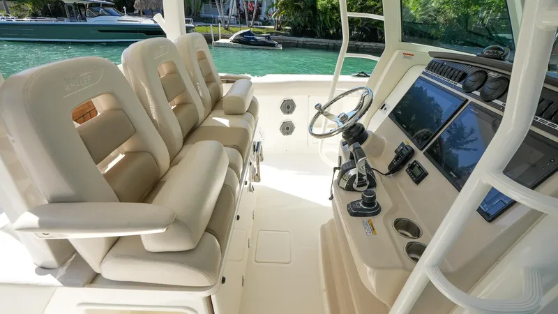  Yacht Photos Pics 2019 Boston Whaler 380 Outrage helm with luxurious seating and advanced controls.