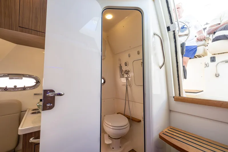  Yacht Photos Pics Interior of 2019 Boston Whaler 380 Outrage boat featuring compact bathroom.