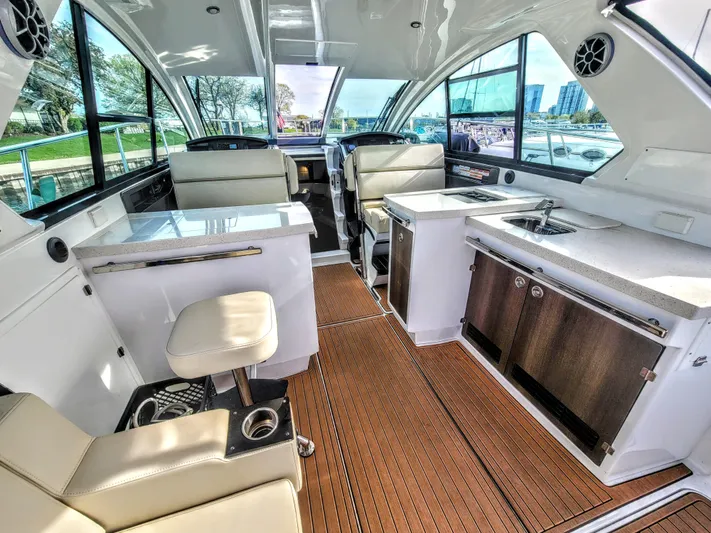  Yacht Photos Pics Luxurious interior of 2017 Monterey 360 Sport Coupe yacht with modern amenities and seating.