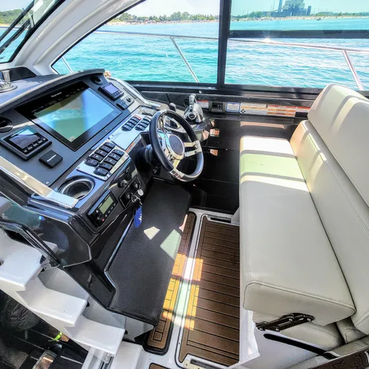  Yacht Photos Pics 2017 Monterey 360 Sport Coupe helm with modern controls and luxurious seating.