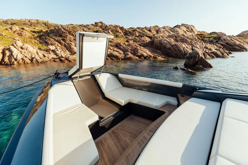 Maclean Yacht Photos Pics Maori 54 yacht 2020 model, luxury seating area with scenic rocky coastline.