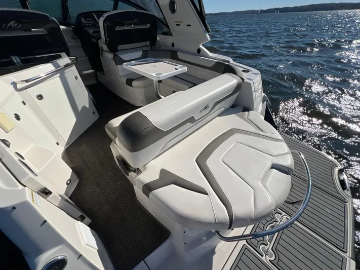  Yacht Photos Pics 2014 Monterey 320 Sport Yacht interior with seating, table, and ocean view.