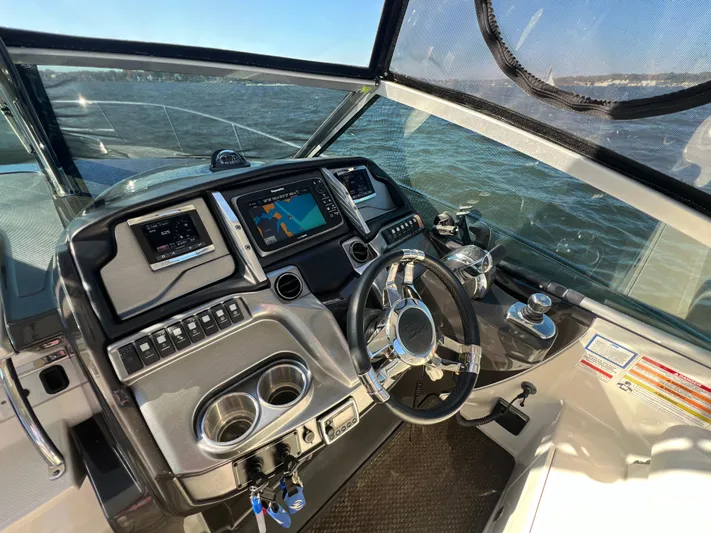  Yacht Photos Pics Cockpit of 2014 Monterey 320 Sport Yacht with modern navigation system and steering wheel.