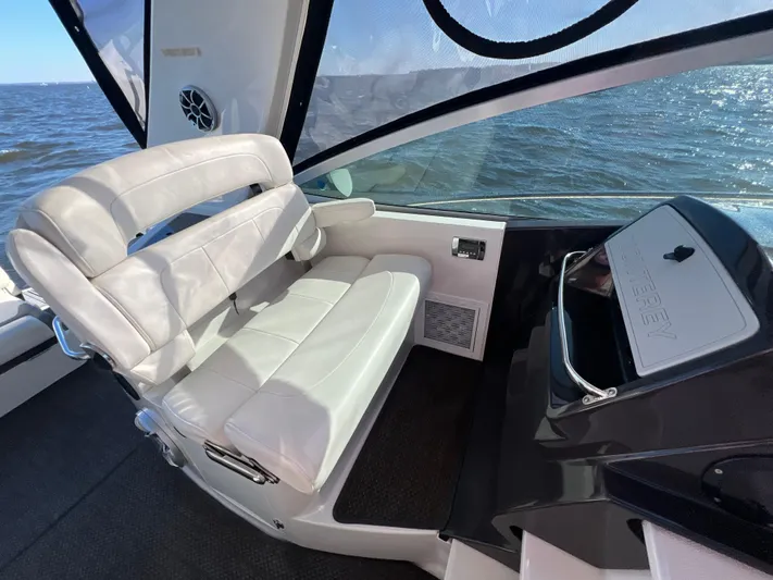  Yacht Photos Pics 2014 Monterey 320 Sport Yacht interior with white seating and ocean view.