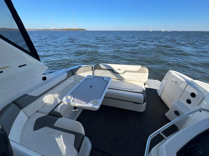  Yacht Photos Pics 2014 Monterey 320 Sport Yacht interior with seating, table, and ocean view.