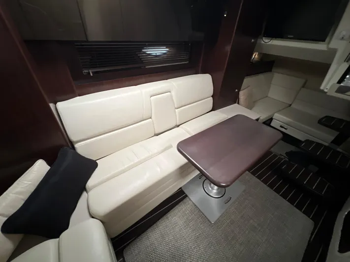  Yacht Photos Pics Interior of 2014 Monterey 320 Sport Yacht with beige seating and dark wood accents.