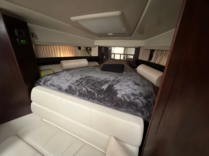 Yacht Photos Pics Luxurious interior of 2014 Monterey 320 Sport Yacht with plush bedding and elegant design.