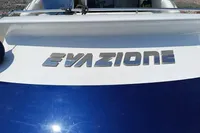2005 Pershing 76 yacht with "EVASIONE" nameplate, blue and white exterior.