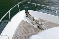 Bow of 2005 Pershing 76 yacht with teak decking and anchor system.