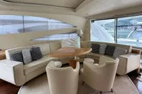 Luxurious interior of 2005 Pershing 76 yacht with elegant seating and modern design.
