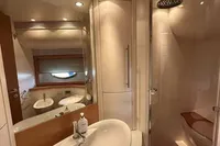 Luxurious bathroom in a 2005 Pershing 76 yacht with modern fixtures and elegant design.
