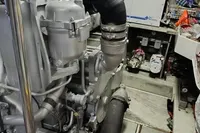 Engine room of a 2005 Pershing 76 yacht, showcasing mechanical components and equipment.