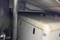 Engine room of a 2005 Pershing 76 yacht, showcasing machinery and equipment.