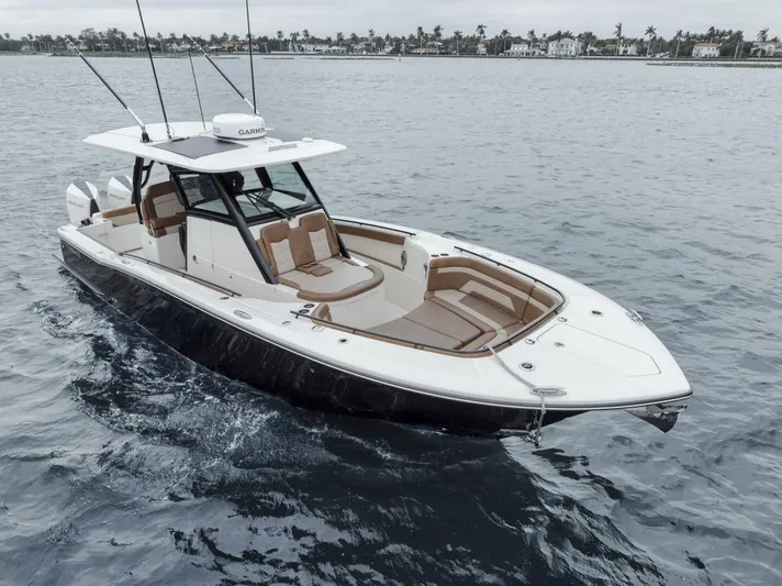 T/t Phoenix Yacht Photos Pics 2023 Scout 330 LXF boat on water, featuring sleek design and spacious seating.