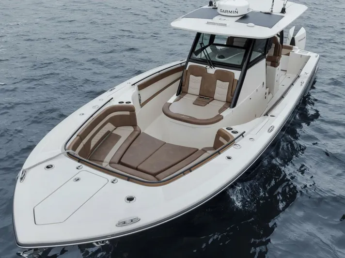 T/t Phoenix Yacht Photos Pics 2023 Scout 330 LXF boat on water, featuring sleek design and spacious seating.