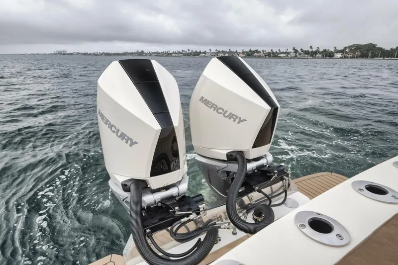 T/t Phoenix Yacht Photos Pics 2023 Scout 330 LXF boat with dual Mercury outboard engines on the water.