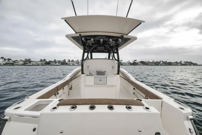 T/t Phoenix Yacht Photos Pics 2023 Scout 330 LXF boat on water, showcasing spacious deck and sleek design.