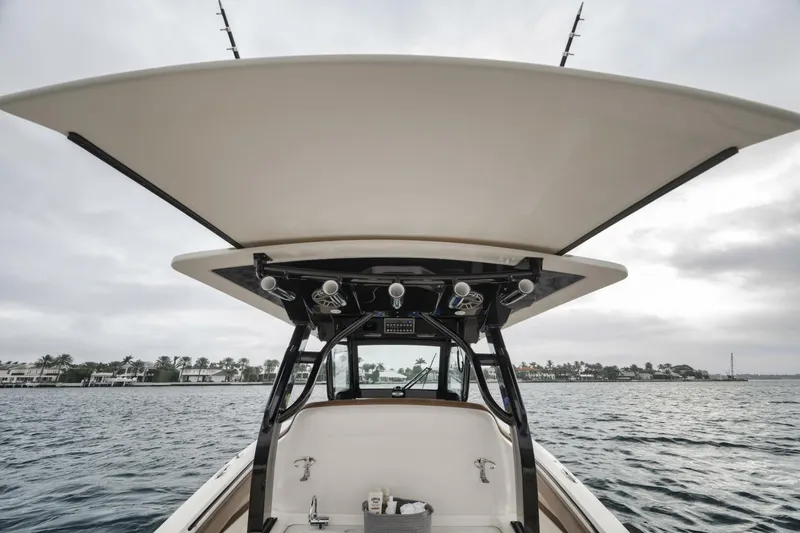 T/t Phoenix Yacht Photos Pics 2023 Scout 330 LXF boat on water, showcasing sleek design and spacious deck.