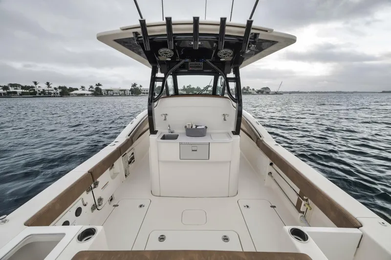 T/t Phoenix Yacht Photos Pics 2023 Scout 330 LXF boat interior, featuring spacious deck and modern amenities on the water.