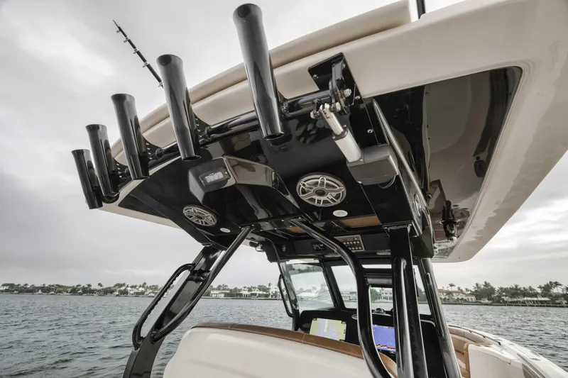 T/t Phoenix Yacht Photos Pics 2023 Scout 330 LXF boat with rod holders and speakers on the deck.