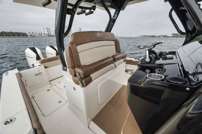 T/t Phoenix Yacht Photos Pics 2023 Scout 330 LXF boat interior with luxurious seating and modern controls.