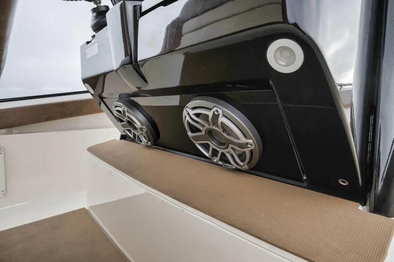 T/t Phoenix Yacht Photos Pics 2023 Scout 330 LXF boat interior with modern speaker system and cushioned seating.